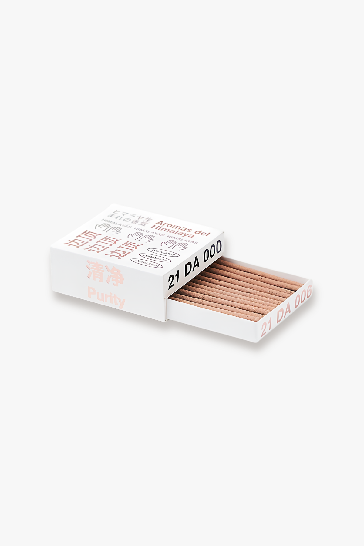 A white matchbox with a sliding open drawer showing light brown wooden matches. The matchbox features minimalist text in black and muted pink, including '21 DA 000' and 'Purity'.