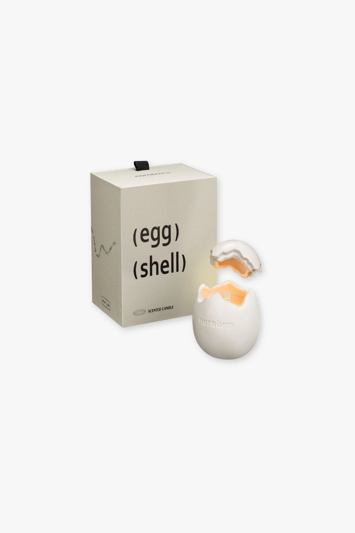 nornorm Small egg-shaped object with a cracked shell and packaging labeled 'egg (shell)' on a white background
