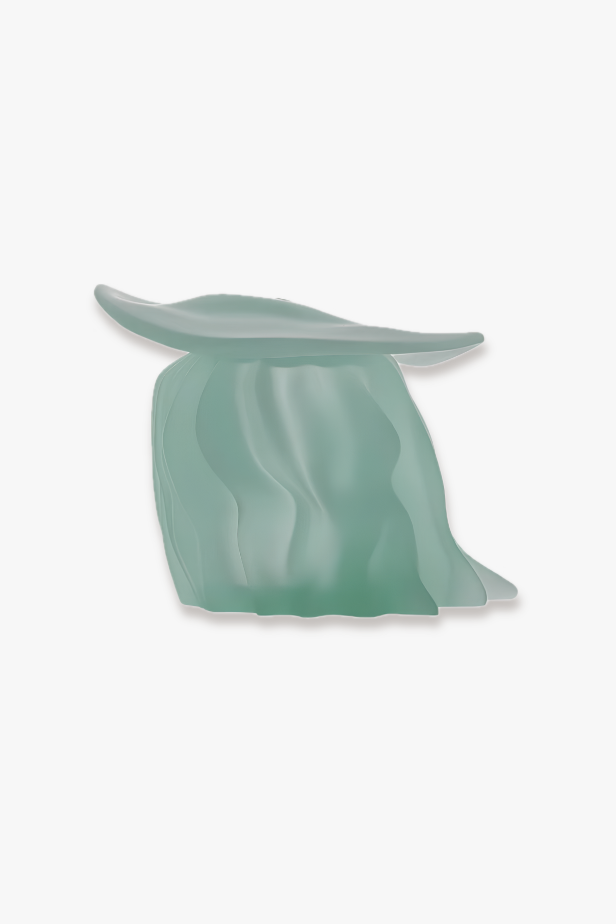 A sculptural, abstract leaf-shaped decorative object in a translucent sage green color, shown against a plain white background.