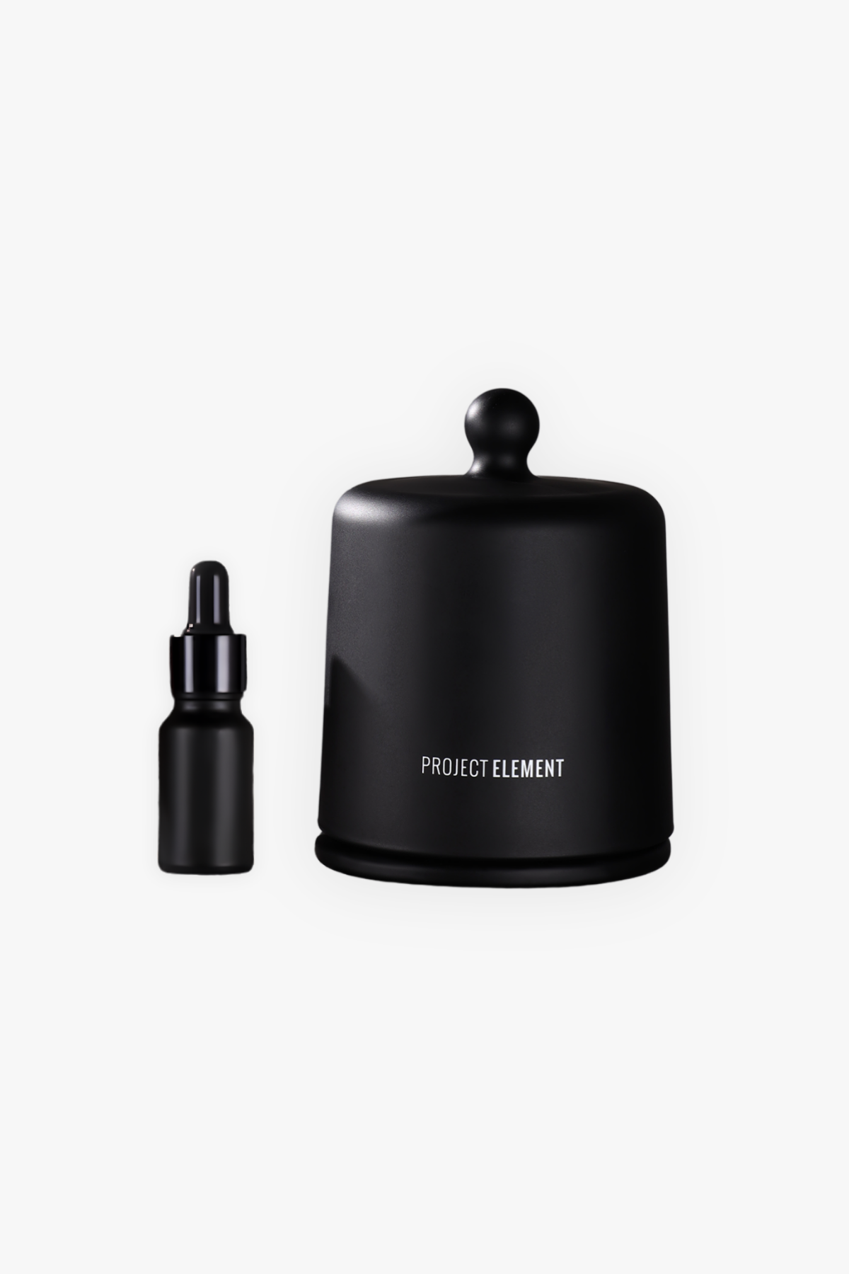 Black container and dropper bottle with 'Project Element' branding on a white background