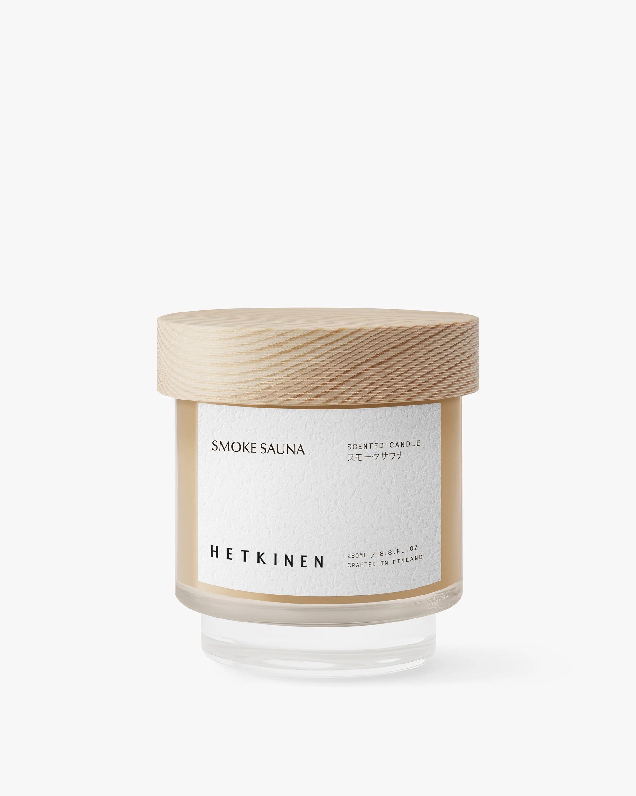 Candle with wooden lid and label on a white background